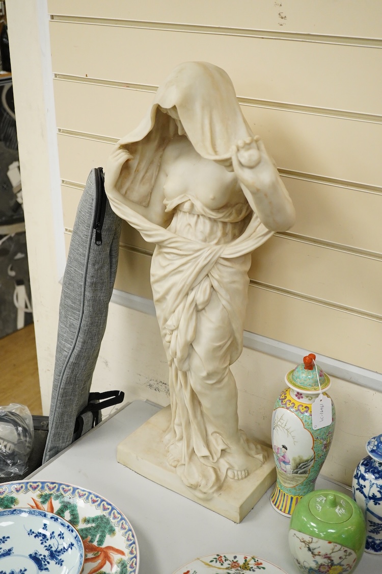 A large simulated marble statuette of a semi nude female, 73cm high